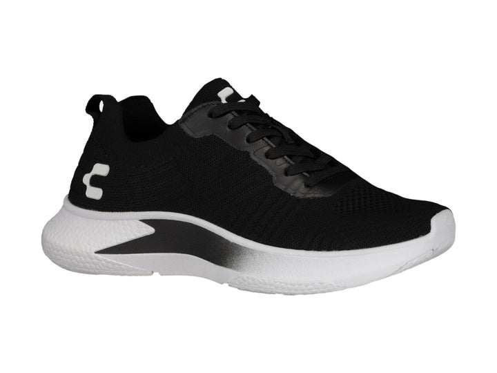 Tenis deportivos Charly color negro con suela blanca.
