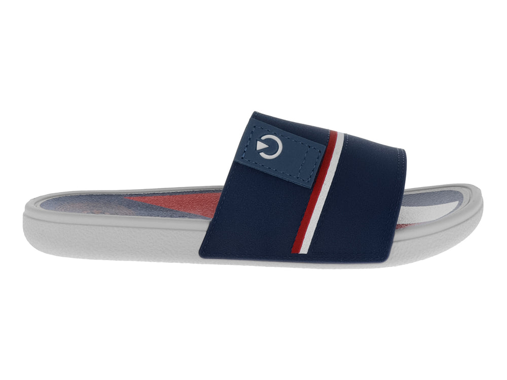 Sandalia tipo slide para niño en color azul marino con franjas blanca y roja y suela blanca.