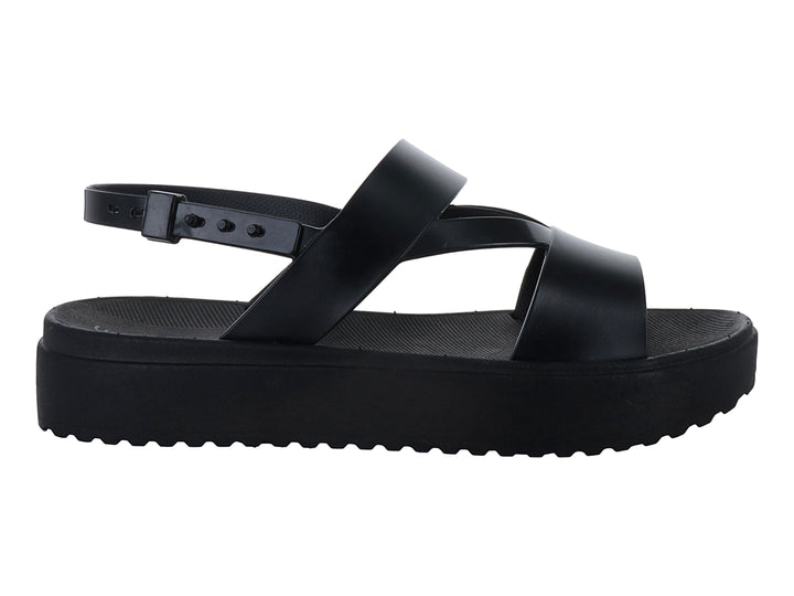 Sandalias negras de plataforma con suela dentada y correas cruzadas con hebilla para mujer.