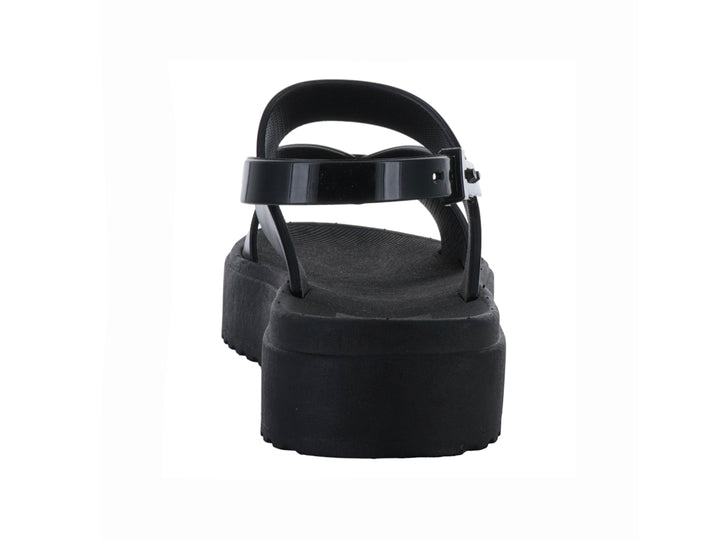 Sandalias negras de plataforma con suela dentada y correas cruzadas con hebilla para mujer.