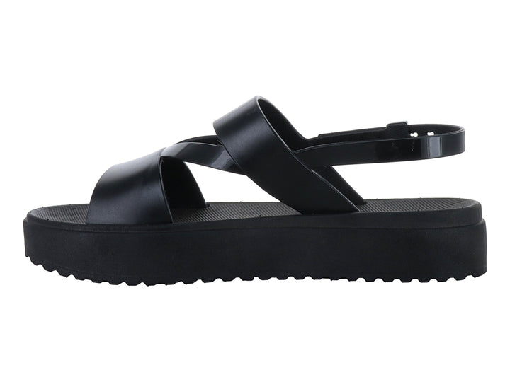 Sandalias negras de plataforma con suela dentada y correas cruzadas con hebilla para mujer.