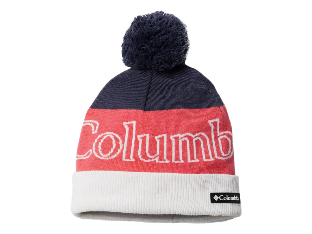 Gorro unisex Columbia multicolor en azul, rosa y blanco con pompón superior.
