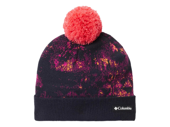Gorro Columbia multicolor con estampado abstracto en tonos azul y rosa, rematado con un pompón rosa brillante.