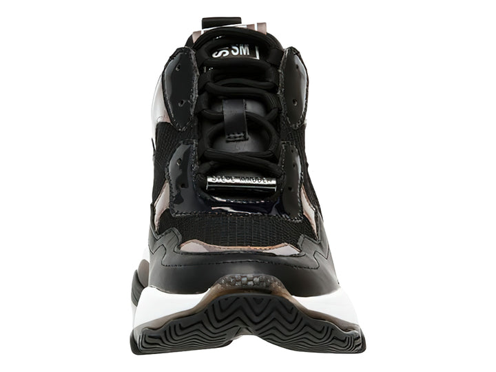 Tenis negros Steve Madden con suela blanca ancha y detalles metálicos iridiscentes.