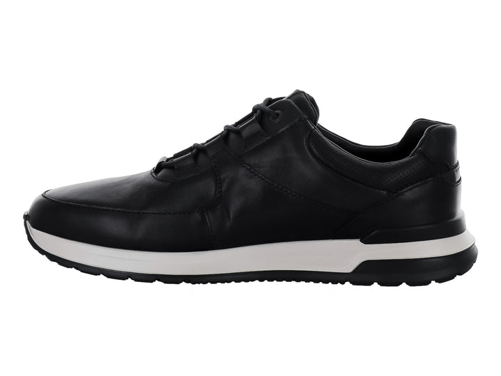 Zapato casual Quirelli color negro con suela blanca y cierre de cordones.