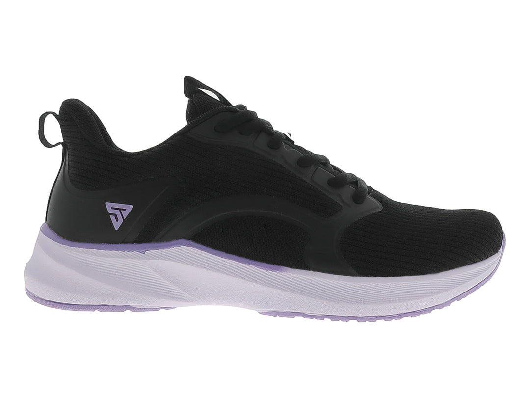 Tenis deportivos JUSTART color negro con suela violeta claro.
