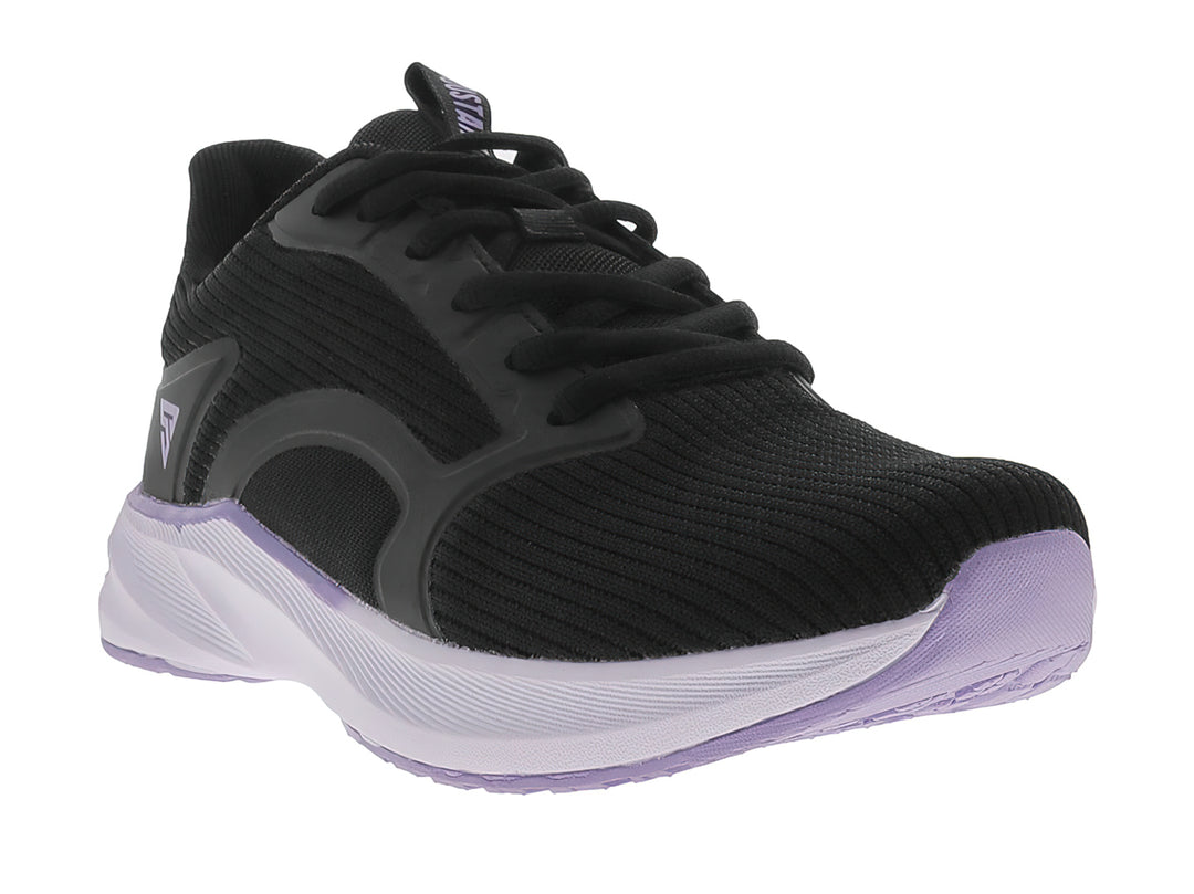 Tenis deportivos JUSTART color negro con suela violeta claro.