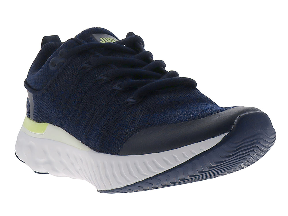 Tenis deportivos Justart en color azul marino con detalles en amarillo limón y suela blanca.