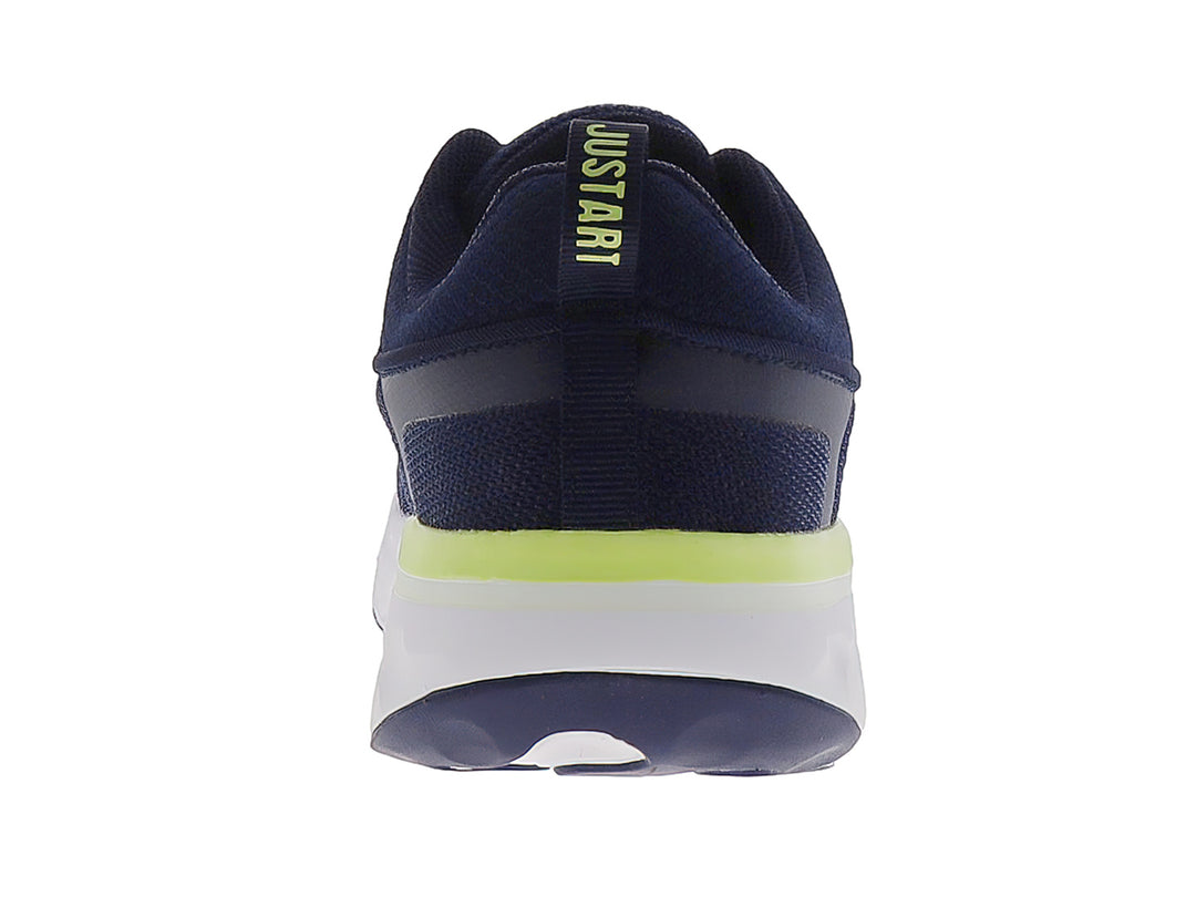 Tenis deportivos Justart en color azul marino con detalles en amarillo limón y suela blanca.