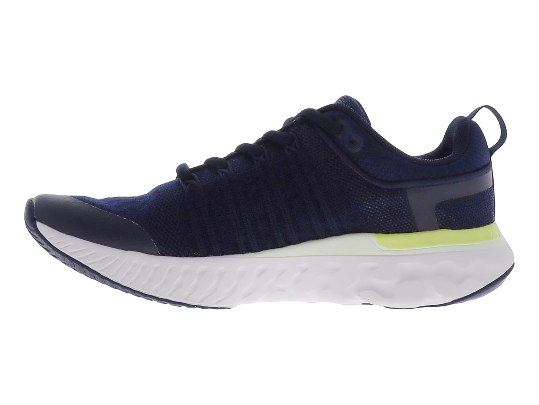 Tenis deportivos Justart en color azul marino con detalles en amarillo limón y suela blanca.