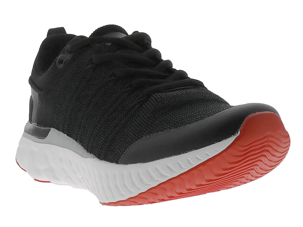 Zapato deportivo JUSTART color negro con suela blanca y base roja.
