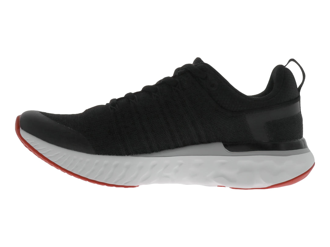 Zapato deportivo JUSTART color negro con suela blanca y base roja.