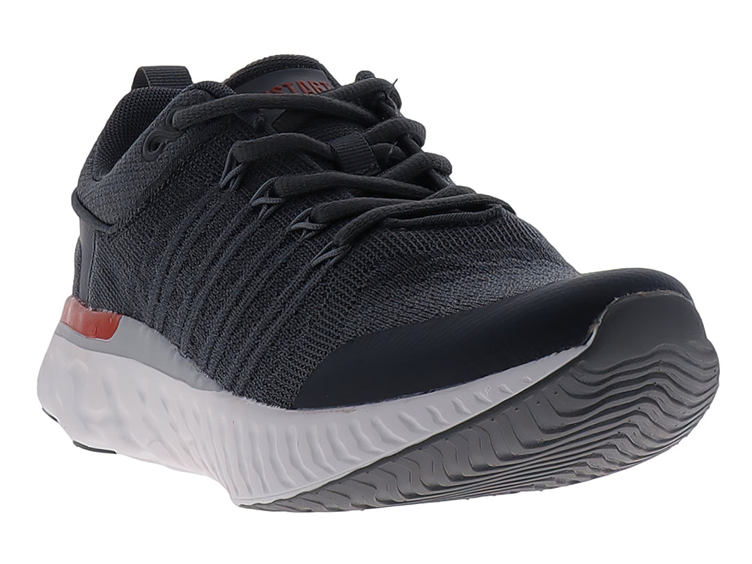 Tenis de baloncesto JUSTART color gris oscuro con suela blanca y un detalle en rojo.