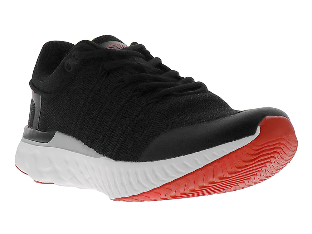 Tenis de baloncesto JUSTART color negro con suela blanca y base roja.