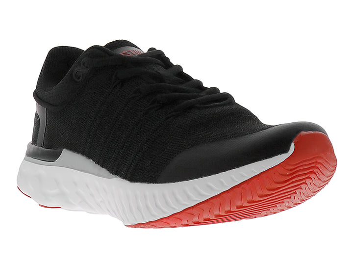 Tenis de baloncesto JUSTART color negro con suela blanca y base roja.