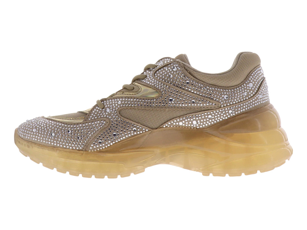Tenis GUESS color natural con incrustaciones de brillantes y suela gruesa translúcida.