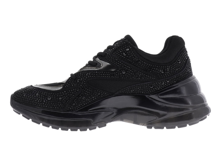 Tenis deportivos Guess color negro con detalles de brillantes y suela gruesa.