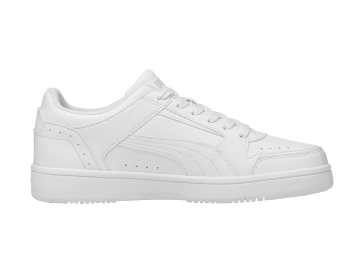 Tenis PUMA Rebound Joy Low en color blanco, vista lateral sobre fondo blanco.