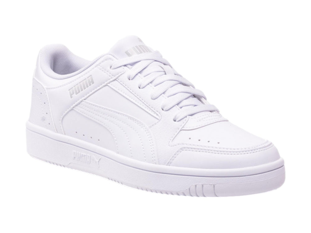 Tenis PUMA Rebound Joy Low en color blanco, vista lateral sobre fondo blanco.
