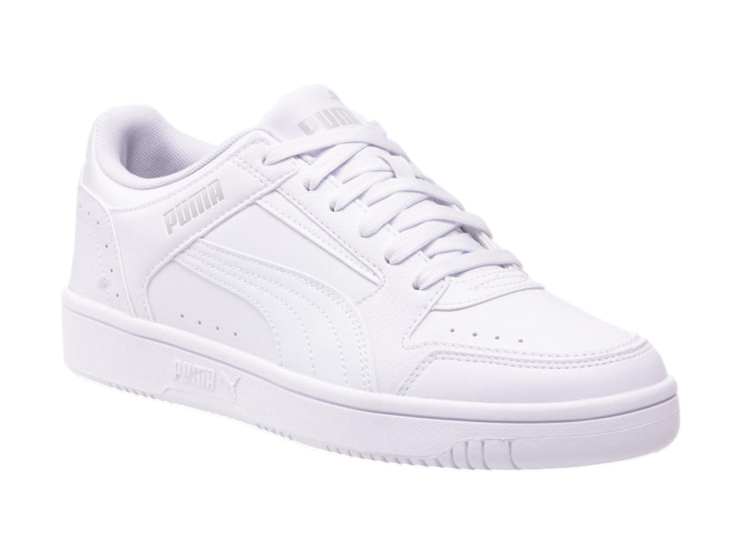Tenis PUMA Rebound Joy Low en color blanco, vista lateral sobre fondo blanco.