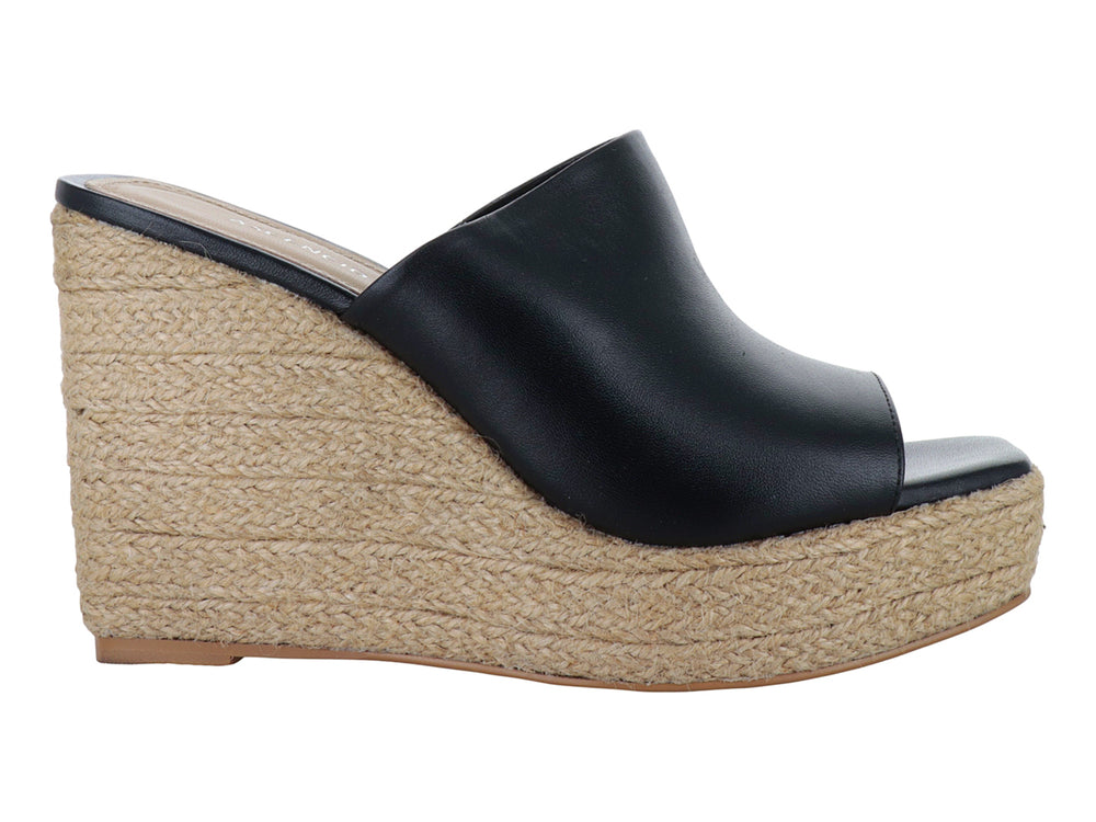 Sandalia de plataforma color negro con base de yute beige para mujer.