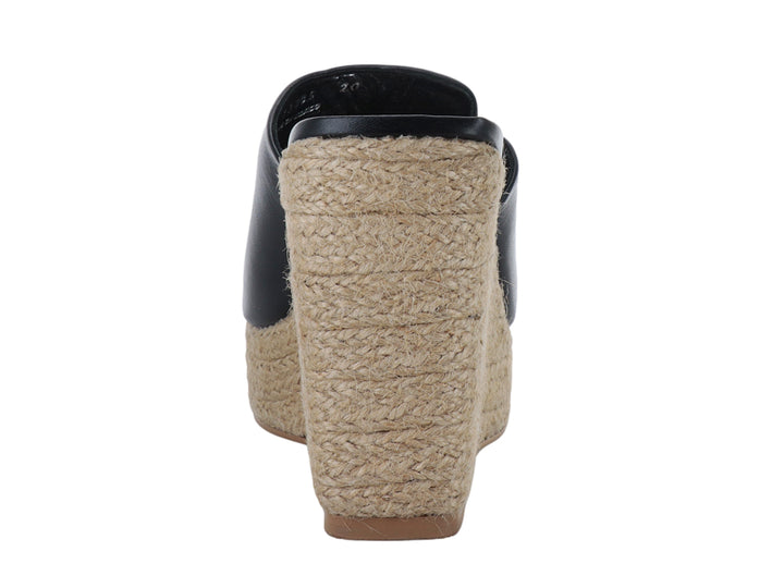Sandalia de plataforma color negro con base de yute beige para mujer.