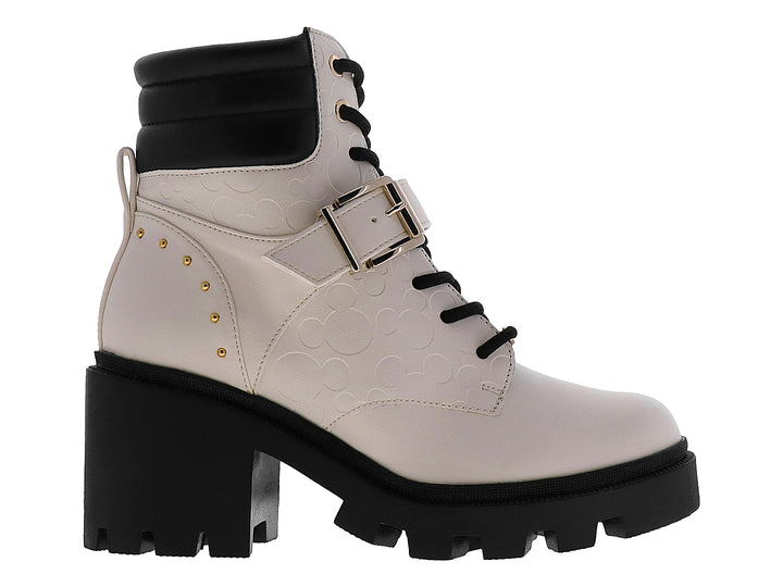 Bota de plataforma color marfil con detalles en negro, agujetas y hebilla metálica.
