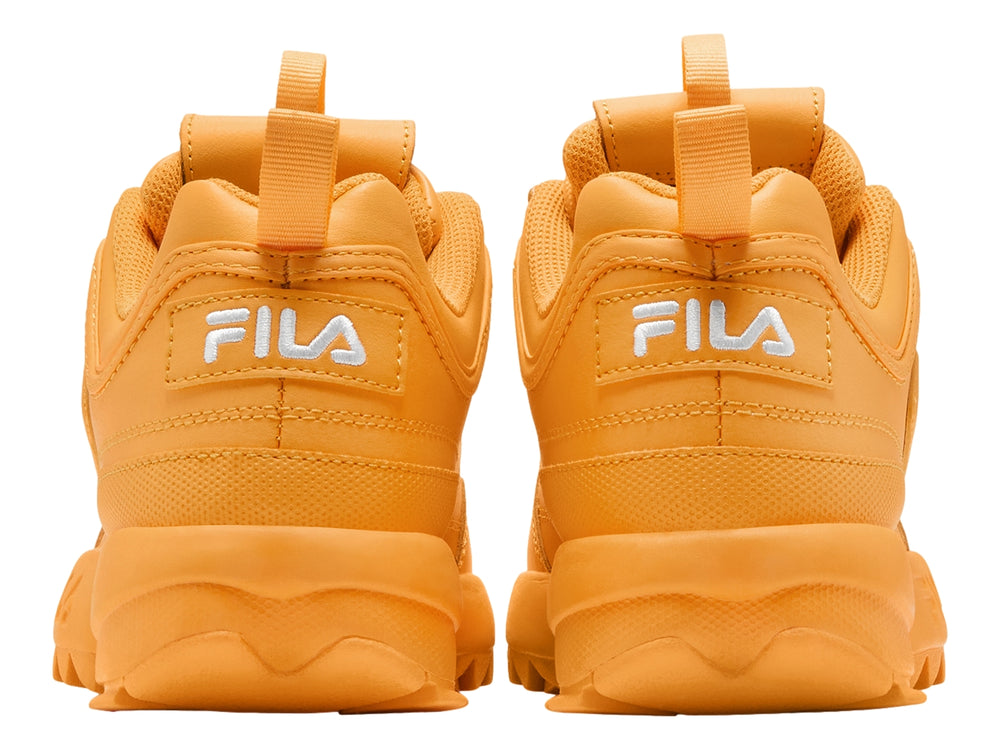 Tenis FILA Disruptor II Premium color amarillo marigold con suela gruesa y dentada.