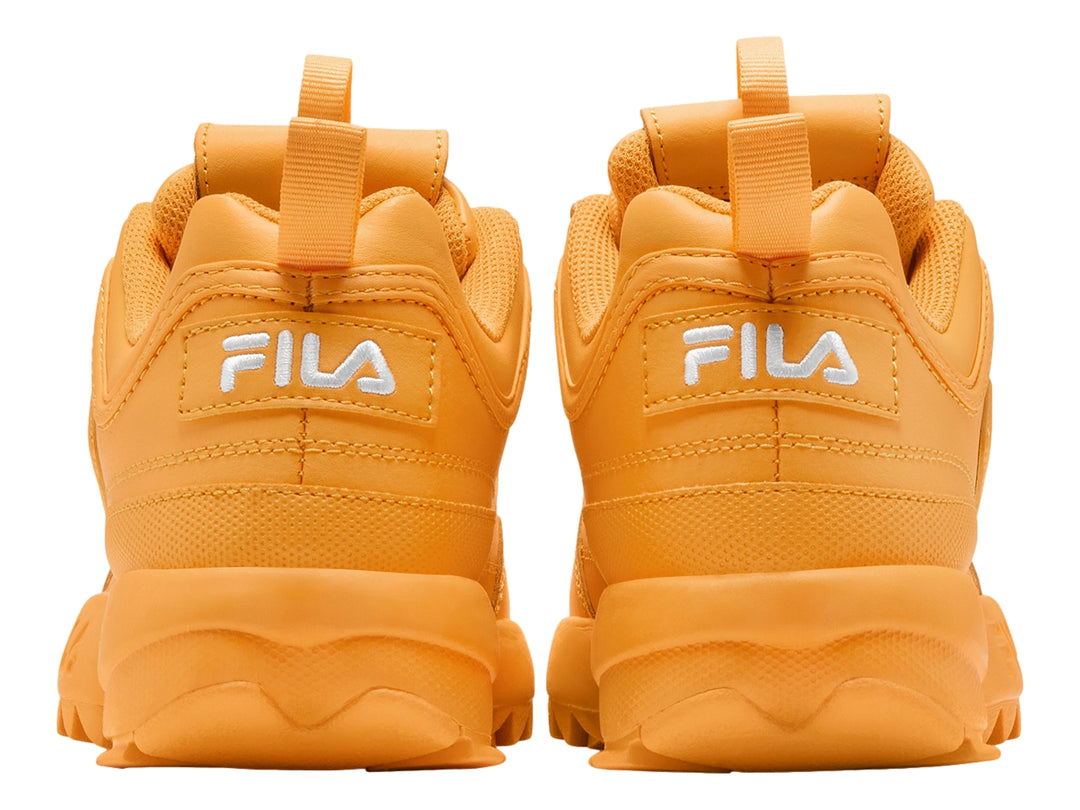 Tenis FILA Disruptor II Premium color amarillo marigold con suela gruesa y dentada.