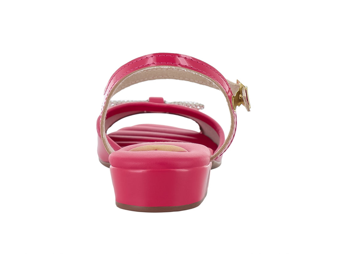 Sandalia rosa brillante para niña con moño decorativo y correa al tobillo.