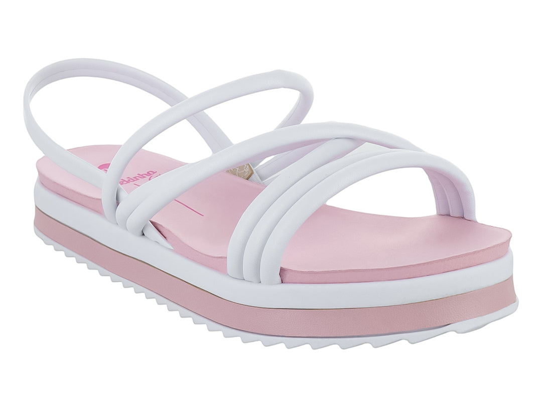 Sandalia de plataforma para niña en colores blanco y rosa con tiras cruzadas y suela dentada.