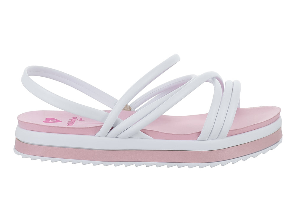 Sandalia de plataforma para niña en colores blanco y rosa con tiras cruzadas y suela dentada.