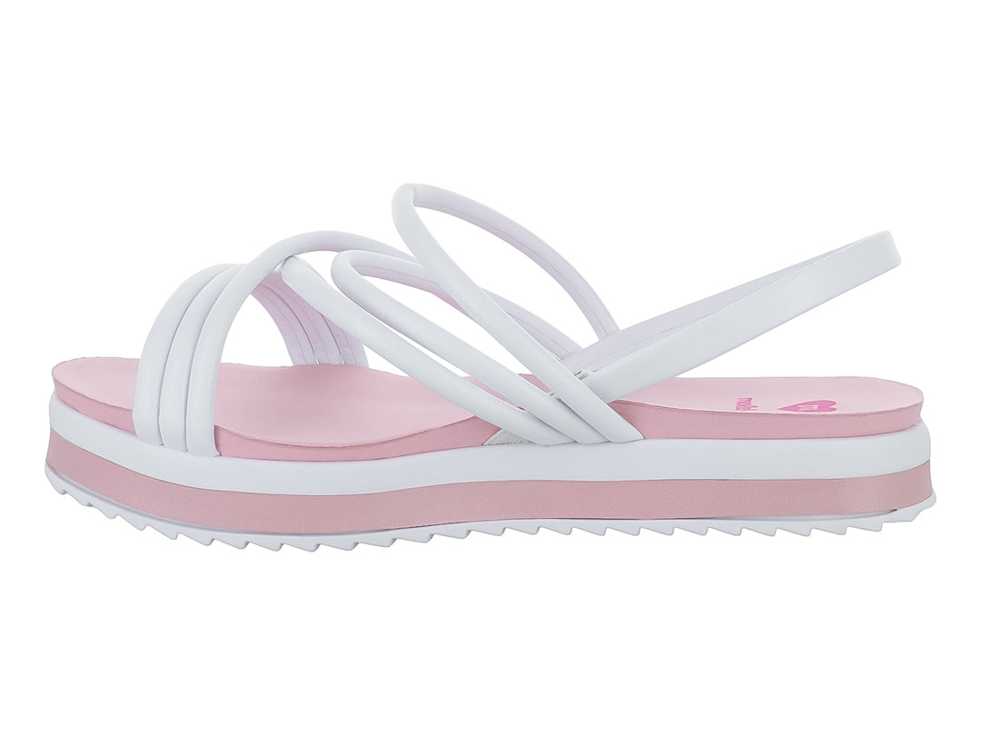 Sandalia de plataforma para niña en colores blanco y rosa con tiras cruzadas y suela dentada.