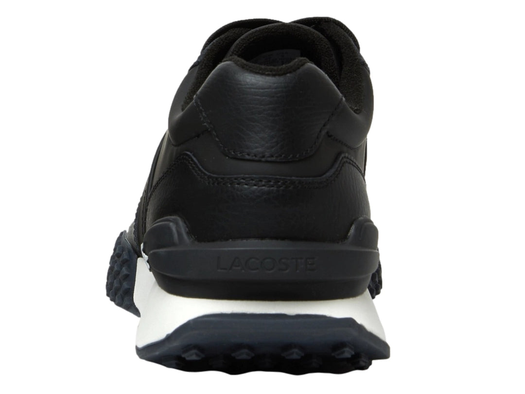 Tenis Lacoste L-Spin Deluxe en color negro con suela blanca y detalles deportivos.