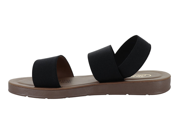 Sandalia CARAY Fanny de color negro con tiras anchas y suela plana en tono marrón.