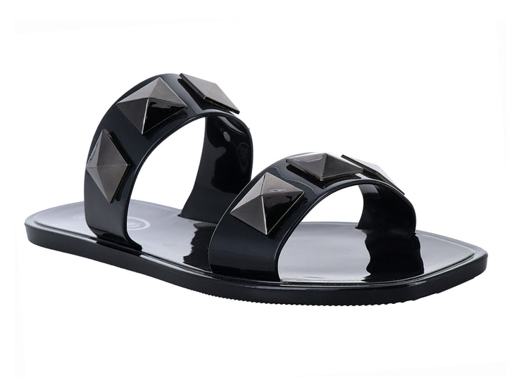 Sandalias negras estilo slide con tachuelas en forma de pirámide.