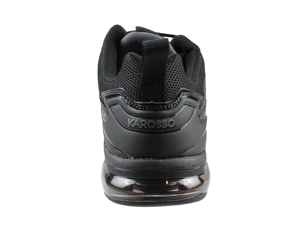 Tenis deportivos de baloncesto color negro con suela de aire y tejido de malla.