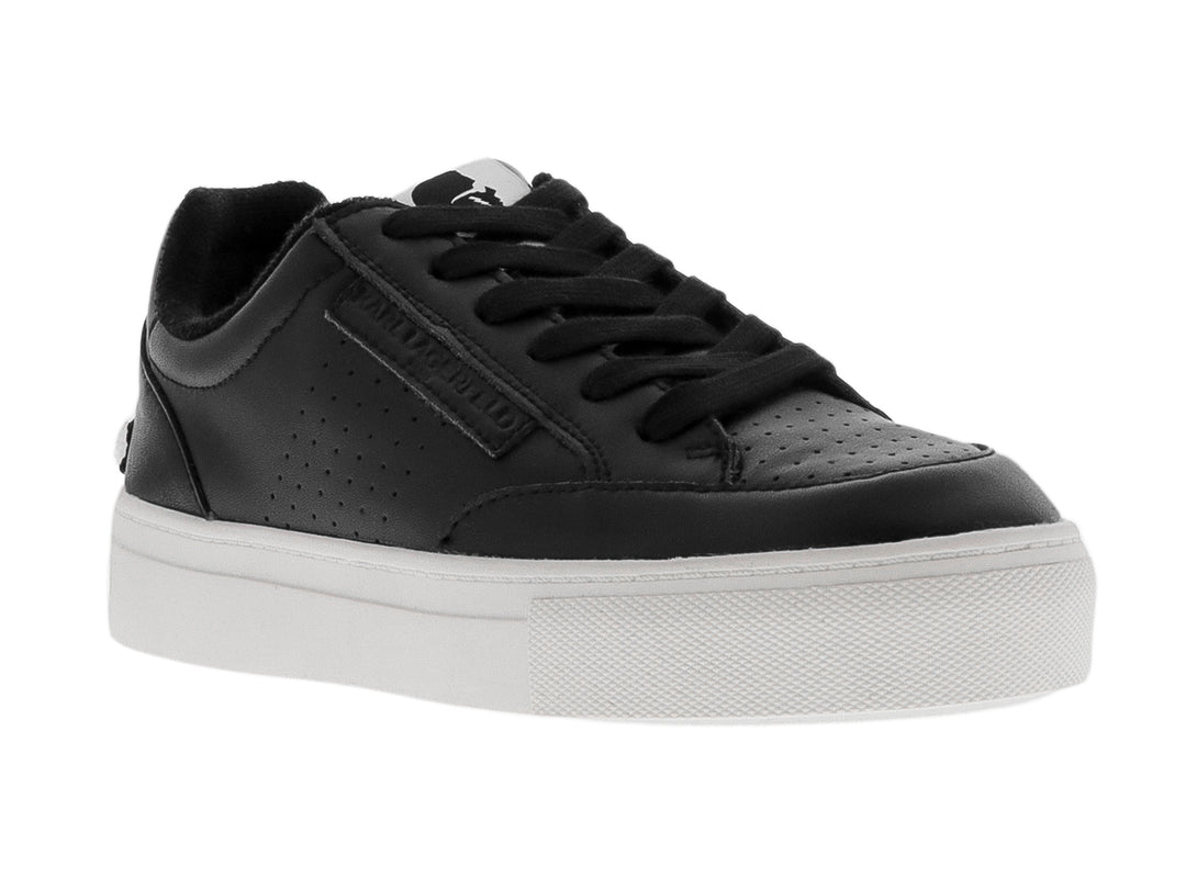 Tenis negros de plataforma con suela blanca y detalles perforados.