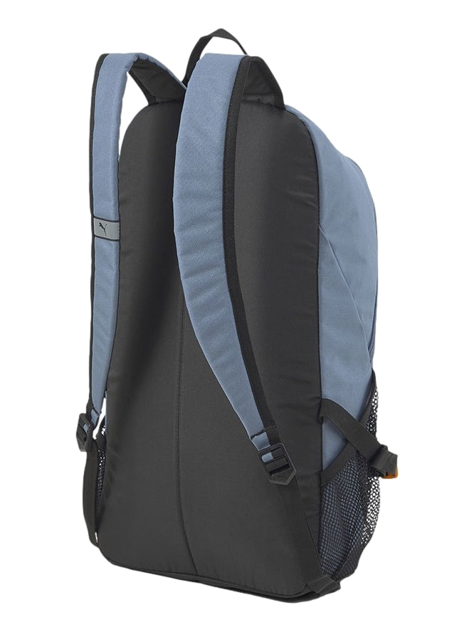 Mochila Puma color azul Evening Sky con detalles en amarillo y negro, ideal para uso escolar o deportivo.