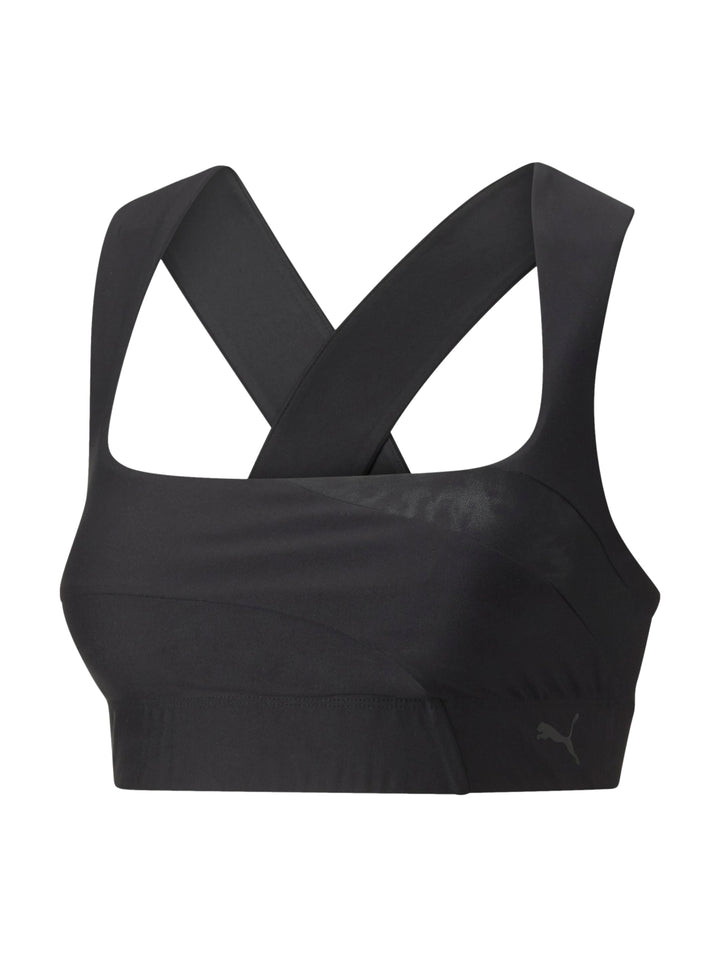 Top deportivo Puma de color negro con tirantes cruzados.