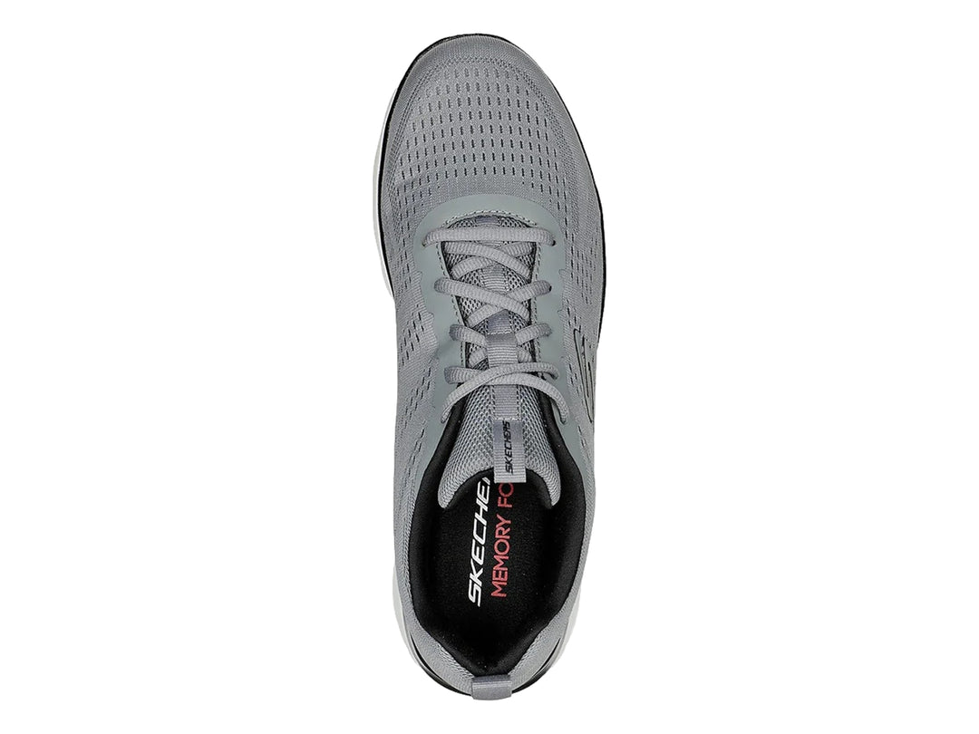 Tenis deportivos Skechers color gris con detalles en negro y suela blanca.