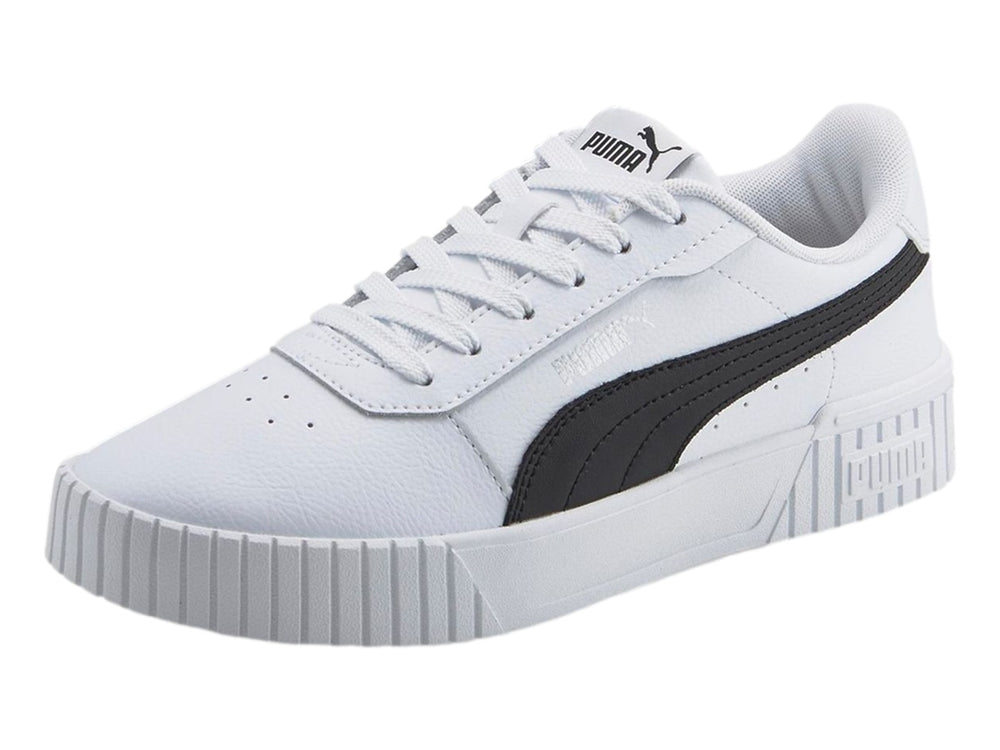 Tenis PUMA Carina 2.0 blancos con franja negra lateral y suela de plataforma blanca.