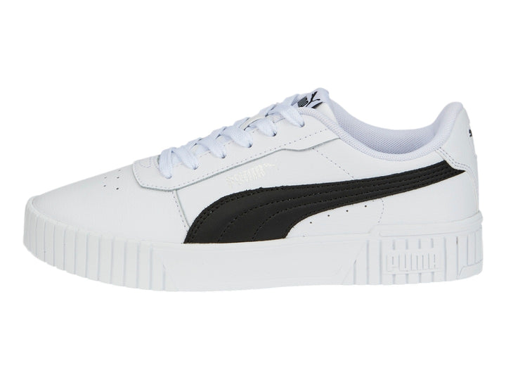 Tenis PUMA Carina 2.0 blancos con franja negra lateral y suela de plataforma blanca.
