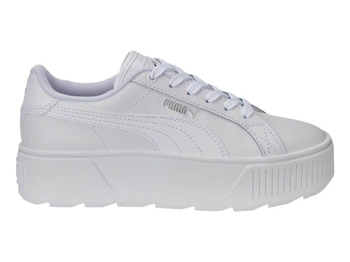 Tenis PUMA blancos con suela de plataforma gruesa y cordones.