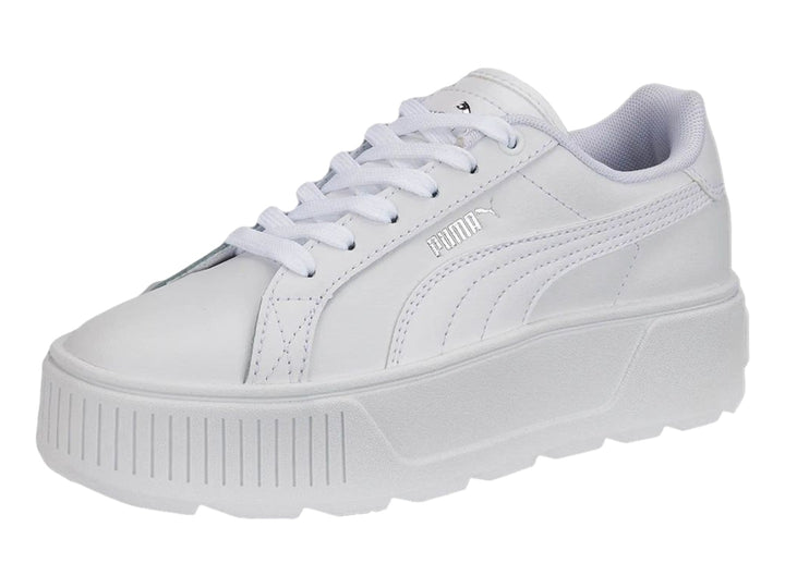 Tenis PUMA blancos con suela de plataforma gruesa y cordones.
