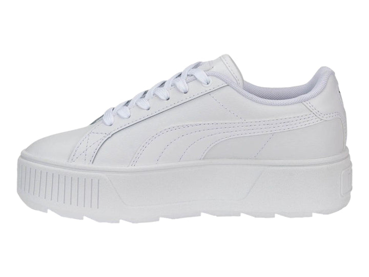 Tenis PUMA blancos con suela de plataforma gruesa y cordones.
