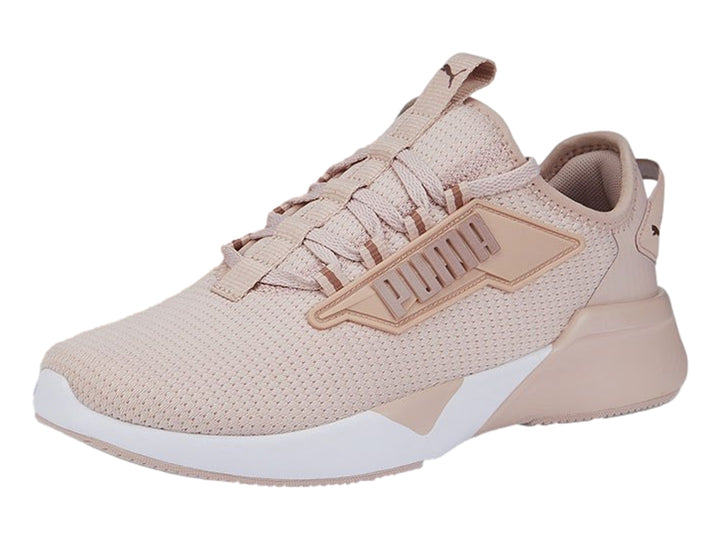 Tenis deportivos PUMA Retaliate 2 en color rosa cuarzo con suela blanca y detalles en malla.