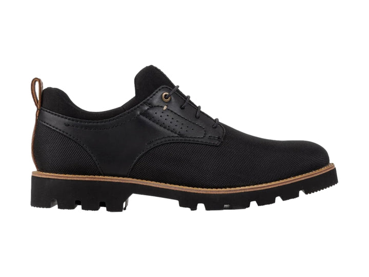 Zapato casual de lona color negro con suela gruesa y detalles en marrón, vista lateral.