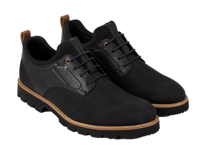 Zapato casual de lona color negro con suela gruesa y detalles en marrón, vista lateral.