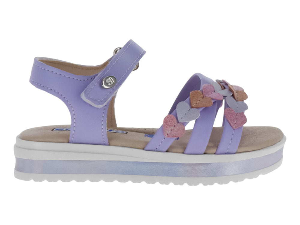 Sandalias lila para niña con plataforma blanca y adornos de corazones en tonos rosa y lila.